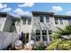 Cozy townhome backyard featuring a patio with seating and a well-maintained exterior at 1066 Chicory Trce, Lake Wylie, SC 29710