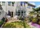 Residential backyard with a paved patio, manicured landscaping, and an AC unit enhancing outdoor living at 1066 Chicory Trce, Lake Wylie, SC 29710