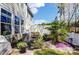 Landscaped backyard featuring rock beds, green grass, and an AC unit, surrounded by a privacy fence at 1066 Chicory Trce, Lake Wylie, SC 29710