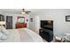 Bedroom featuring a large bed, wood flooring, and a black entertainment center at 1066 Chicory Trce, Lake Wylie, SC 29710