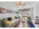 Bright bedroom with a ceiling fan, a daybed and hardwood floors filled with light from the large window at 1066 Chicory Trce, Lake Wylie, SC 29710