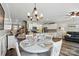 Open dining area with bright light fixture leading to a spacious kitchen and welcoming living room at 1066 Chicory Trce, Lake Wylie, SC 29710