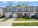 Townhome with a garage, manicured lawn, and a walkway leading to the entrance at 1066 Chicory Trce, Lake Wylie, SC 29710