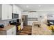 Well-lit kitchen with stainless steel appliances and granite countertops featuring a central island at 1066 Chicory Trce, Lake Wylie, SC 29710