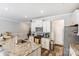 Bright kitchen with stainless steel appliances, granite countertops, and ample cabinet space at 1066 Chicory Trce, Lake Wylie, SC 29710