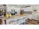 Beautiful kitchen with white cabinets, stainless steel appliances, and granite countertops with bar stool seating at 1066 Chicory Trce, Lake Wylie, SC 29710