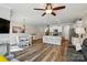 Spacious living area featuring kitchen, dining, and seating areas with hardwood floors at 1066 Chicory Trce, Lake Wylie, SC 29710