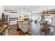 Open-concept living space with kitchen island, dining area, and comfortable seating at 1066 Chicory Trce, Lake Wylie, SC 29710