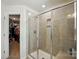 Tiled shower with glass doors and built-in niche at 1066 Chicory Trce, Lake Wylie, SC 29710