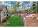 Expansive backyard featuring lush lawn, tiered landscaping, and inviting seating areas for outdoor enjoyment at 10823 Preservation Park Dr, Charlotte, NC 28214