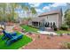 Expansive backyard featuring patio, seating areas, and meticulous landscaping at 10823 Preservation Park Dr, Charlotte, NC 28214