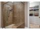 Modern bathroom features a glass-enclosed tile shower and built-in closet space at 10823 Preservation Park Dr, Charlotte, NC 28214