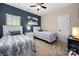 Bright bedroom featuring two twin beds, and fresh neutral colored paint at 10823 Preservation Park Dr, Charlotte, NC 28214