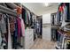 Organized walk-in closet with custom shelving, drawers, and ample hanging space at 10823 Preservation Park Dr, Charlotte, NC 28214