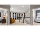 Upstairs hallway with access to bedrooms and a central living space with a piano at 10823 Preservation Park Dr, Charlotte, NC 28214