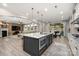 Modern kitchen with an island, stainless steel appliances, and an open concept design at 10823 Preservation Park Dr, Charlotte, NC 28214