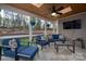 Relaxing screened porch with comfortable seating and views of the outdoor space at 10823 Preservation Park Dr, Charlotte, NC 28214