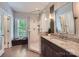 Beautiful bathroom with a glass-enclosed shower, granite countertop, and modern fixtures at 119 Taylor Ct, Mooresville, NC 28117