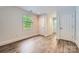 Bright bedroom with wood-look floors, natural light, and neutral paint at 119 Taylor Ct, Mooresville, NC 28117
