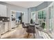 Charming breakfast nook with bay windows and natural light, adjacent to the open-concept living room at 119 Taylor Ct, Mooresville, NC 28117