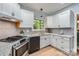 Well-appointed kitchen featuring stainless steel appliances, light cabinetry, and a stylish subway tile backsplash at 119 Taylor Ct, Mooresville, NC 28117