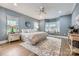 Spacious main bedroom with a large bay window, plush rug, and soothing color palette at 119 Taylor Ct, Mooresville, NC 28117