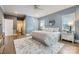Bright main bedroom showcasing a neutral palette, wood floors, and modern accents at 119 Taylor Ct, Mooresville, NC 28117