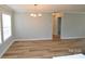 Bright dining room featuring wood-look floors and natural light at 121 Silver Fox Ct, Mount Holly, NC 28120