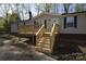 Exterior of home with new wooden porch and stairs at 121 Silver Fox Ct, Mount Holly, NC 28120