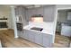Updated kitchen features stainless appliances, gray cabinets, new countertops, and an electric cooktop at 121 Silver Fox Ct, Mount Holly, NC 28120