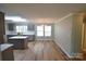 Bright, updated kitchen featuring an island, stainless appliances, and light-filled dining room at 121 Silver Fox Ct, Mount Holly, NC 28120