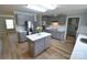 Updated kitchen with stainless appliances, new countertops, gray cabinets, and a center island at 121 Silver Fox Ct, Mount Holly, NC 28120