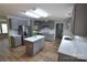Updated kitchen with grey cabinets, stainless steel appliances, island, and new countertops at 121 Silver Fox Ct, Mount Holly, NC 28120
