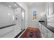 Modern bathroom with a glass-enclosed shower, white subway tile, and a sleek vanity at 1212 Queens Rd, Charlotte, NC 28207