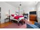 Inviting bedroom with a four-poster bed, a fireplace, and a cozy sitting area at 1212 Queens Rd, Charlotte, NC 28207