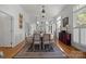 Elegant dining room with hardwood floors, a decorative rug, and a fireplace at 1212 Queens Rd, Charlotte, NC 28207