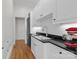 Bright kitchen features white cabinets, subway tile backsplash, and stainless steel appliances at 1212 Queens Rd, Charlotte, NC 28207