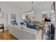 Open-concept living area with a view into the kitchen and modern furnishings at 1212 Queens Rd, Charlotte, NC 28207