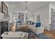 Inviting living room featuring a fireplace, sectional sofa, and hardwood floors at 1212 Queens Rd, Charlotte, NC 28207