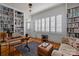Well-lit office featuring built-in bookshelves and a comfortable seating area at 1212 Queens Rd, Charlotte, NC 28207