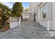 Stately home showcasing an expansive patio and elegant stepped entrance to the backyard at 1212 Queens Rd, Charlotte, NC 28207