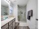 Modern bathroom with glass shower door and vanity with neutral finish at 124 Benford Dr, Troutman, NC 28166
