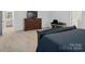 Comfortable bedroom featuring a large dresser and soft carpet at 124 Benford Dr, Troutman, NC 28166