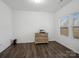 Bright bedroom with hardwood floors, neutral paint, and natural light at 124 Benford Dr, Troutman, NC 28166