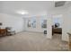 Spacious bonus room with ample windows, neutral paint, and soft carpet at 124 Benford Dr, Troutman, NC 28166