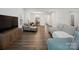 Inviting living room showcasing hardwood floors, neutral walls, and comfortable seating arrangement at 124 Benford Dr, Troutman, NC 28166
