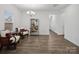 Bright, naturally lit living room with hard wood floors and elegant chandelier at 124 Benford Dr, Troutman, NC 28166