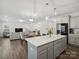 Open-concept living space with hardwood floors, neutral paint and large windows, perfect for Gathering gatherings at 124 Benford Dr, Troutman, NC 28166