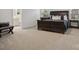 Spacious main bedroom featuring neutral carpet, large windows and en-suite bathroom at 124 Benford Dr, Troutman, NC 28166