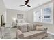 Inviting bedroom with plush carpet, natural light, and a cozy couch for relaxing or reading at 12424 Bradford Park Dr, Davidson, NC 28036